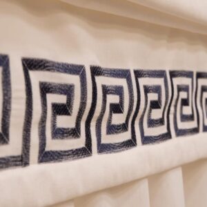 embroidery with meander on a curtain
